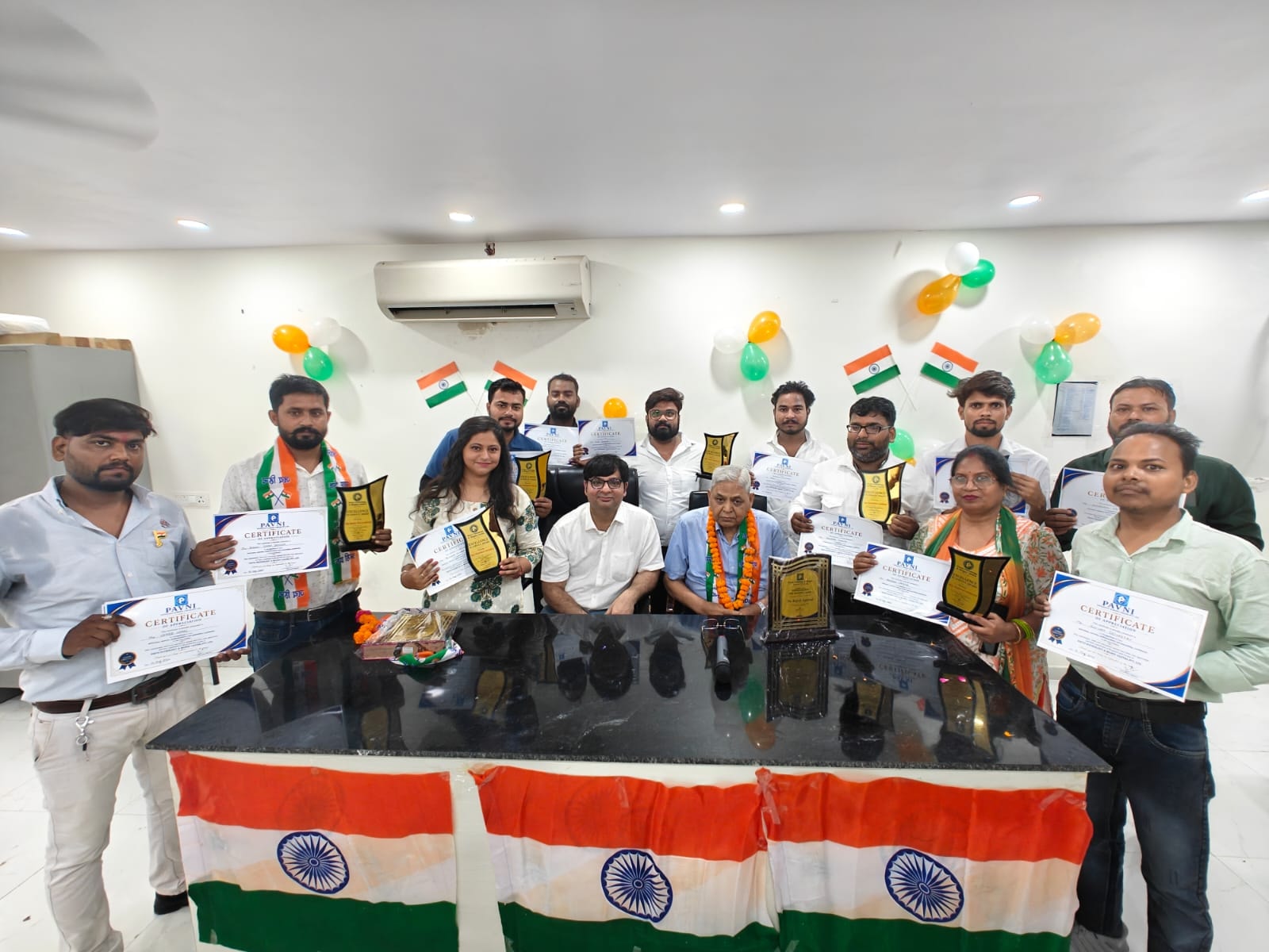 Pavani Pathology team at awards ceremony with certificates and trophies
